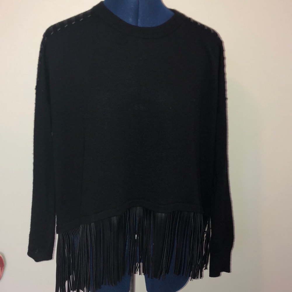Black, leather-fringed sweater